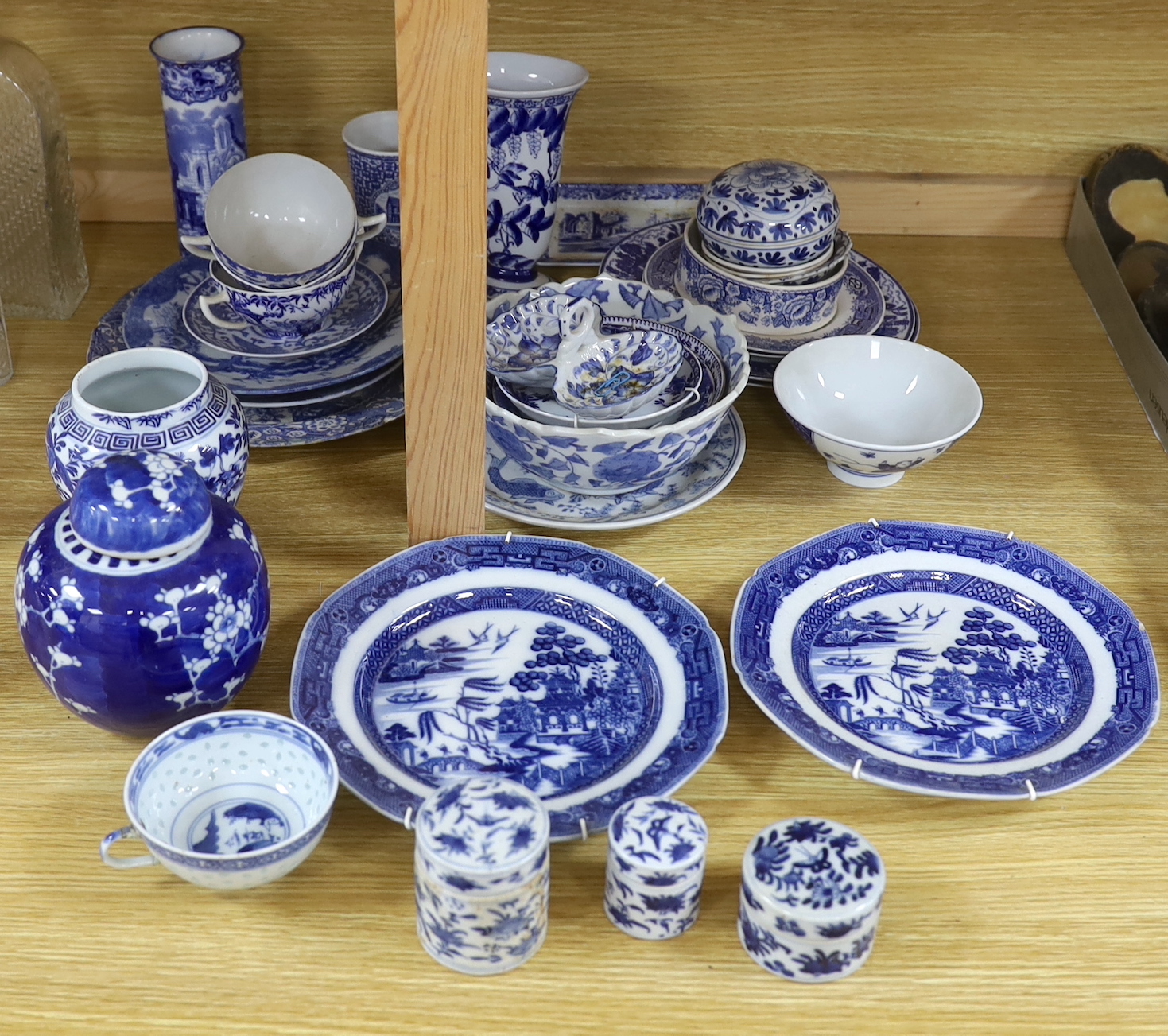 A collection of Chinese and Japanese blue and white jars, export plates and pots, together with European blue and white mixed tea wares